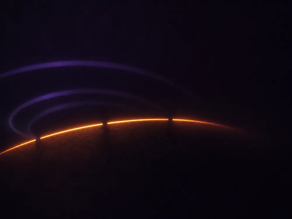 An illuminated arc broken into a few discrete segments, the last one ending cleanly rather than trailing off.